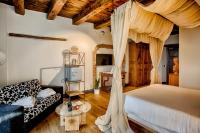 Łóżko lub łóżka w pokoju w obiekcie Dimora storica Giorni resort & spa