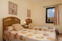 Łóżko lub łóżka w pokoju w obiekcie La Casa del Sol l by Best Holidays Fuerteventura