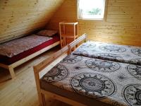 A bed or beds in a room at Chatka vo Vysokých Tatrách