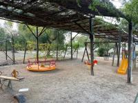 Detský kútik v ubytovaní Happy Camp mobile homes in Porto Cesareo Camping