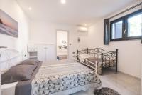 Postel nebo postele na pokoji v ubytování Luxury Villa Ivy