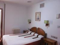 Posteľ alebo postele v izbe v ubytovaní Hotel Elena María