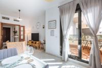Televízia a/alebo spoločenská miestnosť v ubytovaní Apartamento Mairena