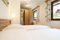 A bed or beds in a room at Lammerauhof