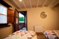 A bed or beds in a room at El Balcon del Horreo