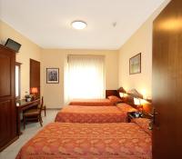 Posteľ alebo postele v izbe v ubytovaní Hotel Pavone