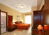 Posteľ alebo postele v izbe v ubytovaní Hotel Pavone