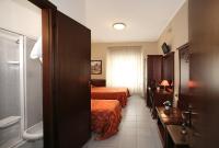Posteľ alebo postele v izbe v ubytovaní Hotel Pavone
