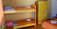 A bed or beds in a room at Agriturismo Usurtala