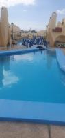 Bazén v ubytovaní Mareverde vista mare con tres piscinas alebo v jeho blízkosti