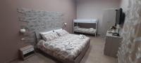 A bed or beds in a room at Vacanze Napoletane