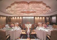 a conference room with tables and chairs and a chandelier at Shangri-La Bangkok in Bangkok