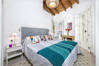 A bed or beds in a room at Mira Apartment in Malaga by Solaga Holiday Homes