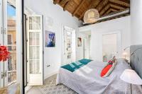 A bed or beds in a room at Mira Apartment in Malaga by Solaga Holiday Homes