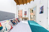 A bed or beds in a room at Mira Apartment in Malaga by Solaga Holiday Homes