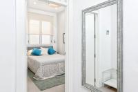 A bed or beds in a room at Mira Apartment in Malaga by Solaga Holiday Homes