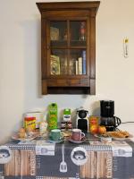 a counter with a table with food on it at Chez Hélène 3 étoiles, labellisé disabled PMR,pour 4 personnes chiens bienvenus-pet friendly in Bourg-Madame