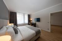 Postel nebo postele na pokoji v ubytování Emily Hotel Leipzig Neue Messe