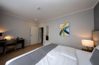 Postel nebo postele na pokoji v ubytování Emily Hotel Leipzig Neue Messe