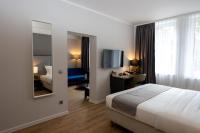 Postel nebo postele na pokoji v ubytování Emily Hotel Leipzig Neue Messe