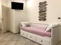 A bed or beds in a room at MIMI'S HOME casa per vacanze