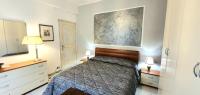 A bed or beds in a room at COMODO AL MARE