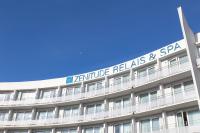 a building with a sign on top of it at Zenitude Relais &amp; Spa - Paris Charles de Gaulle in Roissy-en-France