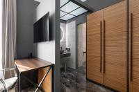 Televízia a/alebo spoločenská miestnosť v ubytovaní Hotel Poerio 25 Boutique Stay