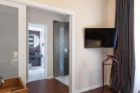 Televízia a/alebo spoločenská miestnosť v ubytovaní Hotel Poerio 25 Boutique Stay