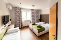 Posteľ alebo postele v izbe v ubytovaní Arion Airport Hotel