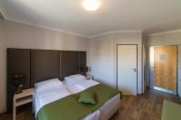 Posteľ alebo postele v izbe v ubytovaní Arion Airport Hotel