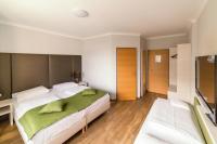 Posteľ alebo postele v izbe v ubytovaní Arion Airport Hotel