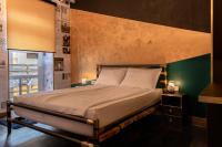 a bedroom with a bed and a green wall at Timeout Heritage Hotel Zagreb in Zagreb