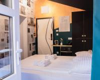 a bedroom with a bed with towels on it at Timeout Heritage Hotel Zagreb in Zagreb