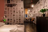 a bedroom with a bed and a wall of papers at Timeout Heritage Hotel Zagreb in Zagreb