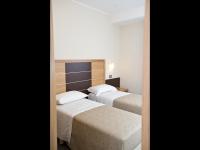 A bed or beds in a room at Hotel Vittoria