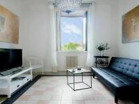 A television and/or entertainment centre at Bacone Liberty Vittoria by Halldis