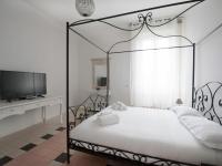 A bed or beds in a room at Bacone Liberty Vittoria by Halldis