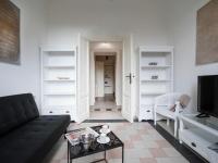A television and/or entertainment centre at Bacone Liberty Vittoria by Halldis