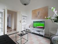 A television and/or entertainment centre at Bacone Liberty Vittoria by Halldis