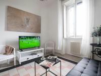 A television and/or entertainment centre at Bacone Liberty Vittoria by Halldis