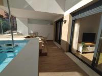 TV a/nebo společenská místnost v ubytování APARTAMENTO TERRAZAS DEL MAR, PISCINA PRIVADA