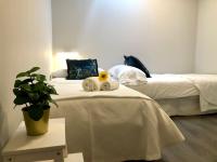 Postel nebo postele na pokoji v ubytování GATU PREMIUM La Casa del Arco con wifi, aire acc, terraza ," Preferente mayores de 25 años y familias "