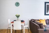 a living room with a table and a couch at City View Apartments Birmingham City Centre in Birmingham