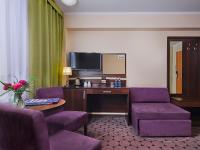 Televízia a/alebo spoločenská miestnosť v ubytovaní Aparthotel Lumen