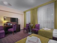 Televízia a/alebo spoločenská miestnosť v ubytovaní Aparthotel Lumen