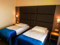 Łóżko lub łóżka w pokoju w obiekcie Hotel Delicjusz