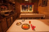 a dining room with a bowl of food on a table at Hotel Hetan Majatalo in Enontekiö