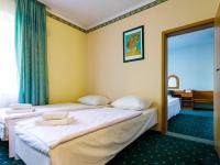 Łóżko lub łóżka w pokoju w obiekcie Hotel Delicjusz