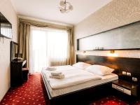 Łóżko lub łóżka w pokoju w obiekcie Hotel Delicjusz